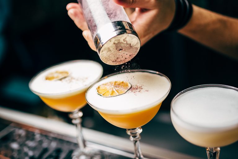 Cocktails being garnished from a bar for hire